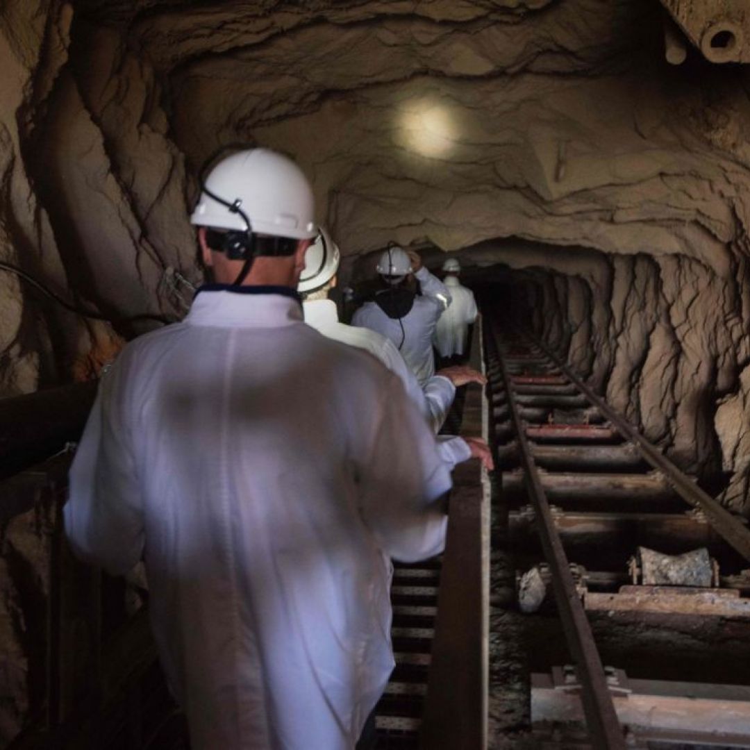 Visitors walk down the inclined shaft at Steenkampskraal rare-earth mine on July 29, 2019, about 80 kilometers (about 50 miles) from Vanrhynsdorp, a town in Western Cape province, South Africa.